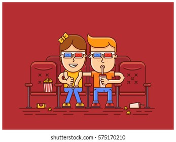 boy and girl watching a movie at the cinema