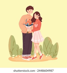 Boy gives a bouquet of flowers to a girl
