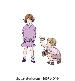Boy gives shy cute girl wild flower. 