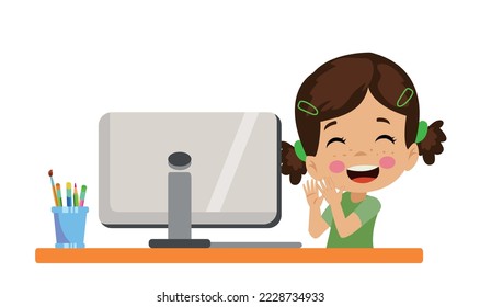 boy with happy facial expression at computer