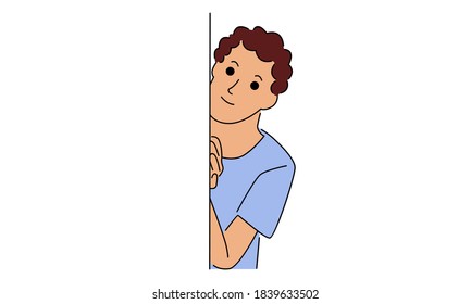Boy hides behind the wall