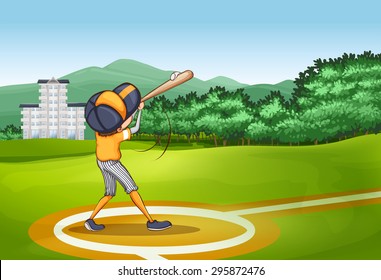 Boy hitting ball with baseball bat in the field