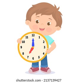 Boy is holding big clock showing seven a.m.