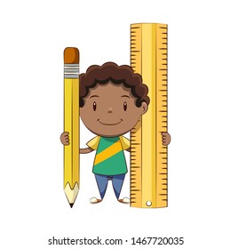 Boy holding big pencil and ruler, happy cute child