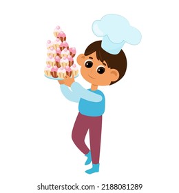 The boy is holding a lot of cupcakes or muffins in his hands. The child is happy and wearing a chef's hat. Character design isolated on white background.