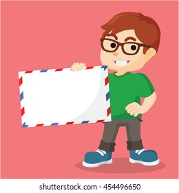 Boy holding giant envelope