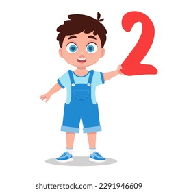 Boy holding a number in his hand