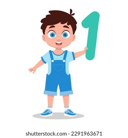 Boy holding a number in his hand