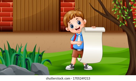 A boy holding paper roll under the tree