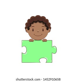 Boy holding puzzle piece, happy cute child