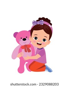 A boy is holding a teddy bear