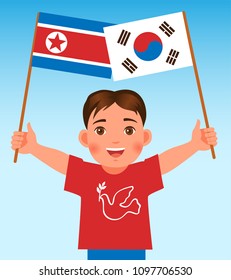 boy holds the flag of South Korea and North Korea flag. 