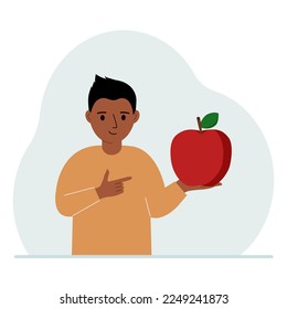 A boy holds a fresh and red apple in his hand. Boy eats an apple. Healthy food concept. Vector flat illustration