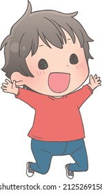 A boy jumping with a smile on his face.