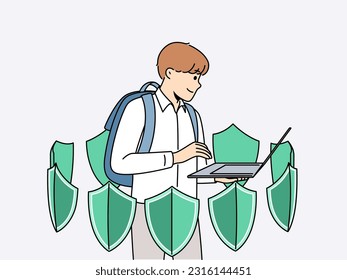 Boy with laptop is learning cyber protect and installing antivirus software standing among green shields. School student uses apps to cyber protect personal data from hackers or viruses