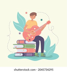 boy learning guitar sitting on books