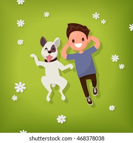 Boy lies with the dog on the lawn. Vector illustration of a flat design