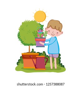 boy lifting houseplant with sprinkler and tree