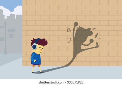 A boy listening music by headphones and walking to the corner street but his shadow look like he dancing and so happy.