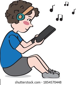 
boy listening to music and watching his cell phone or tablet
