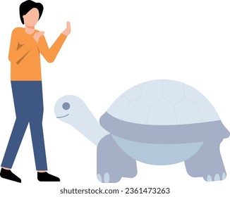 The boy is looking at the turtle.