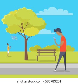 Boy looks at smartphone and walks in park where other guy plays with quadrocopter. Green tree, wooden bench, bushes and clouds on background. Vector illustration of modern outdoor recreation.