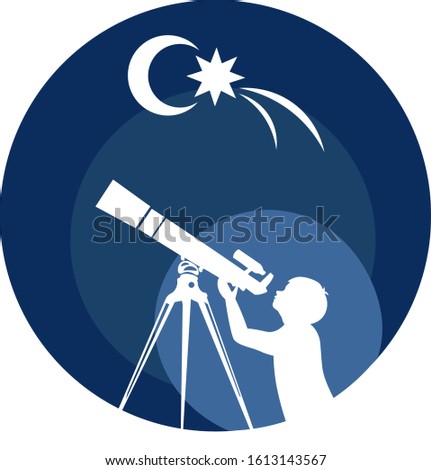 boy looks through a telescope