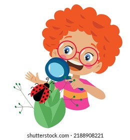 Boy with magnifying glass examines ladybug