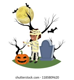 boy with mommy costume in the cementery with pumpkin