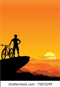 A boy with a mountain bike â?? sunset landscape.