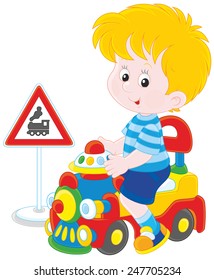 Boy on a toy train