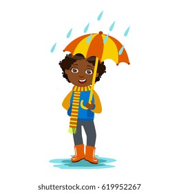 Boy With Open Umbrella Standing Under Raindrops, Kid In Autumn Clothes In Fall Season Enjoyingn Rain And Rainy Weather, Splashes And Puddles