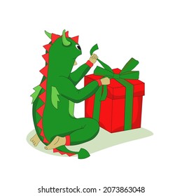 Boy in pajamas Dragon unpacks a gift on a white background