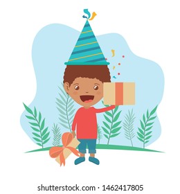 boy with party hat and gift box in birthday celebration