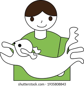 Junge, der einen Hund aufnimmt
