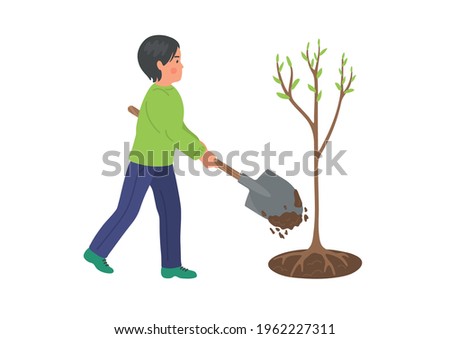 Boy plants tree. Springtime. Child with shovel working and dig ground. 