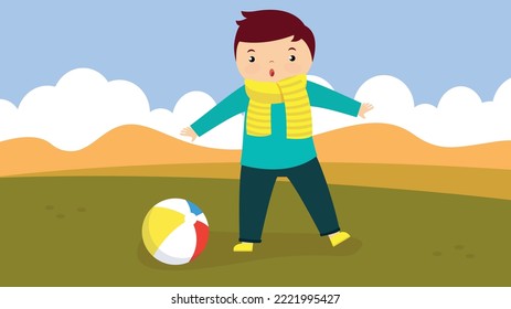 boy playing with a ball on the background of autumn nature