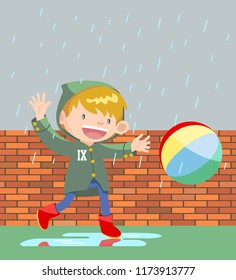 boy playing ball under rain