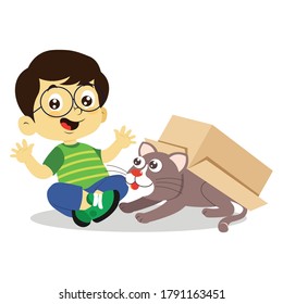 boy playing with cat in cardboard