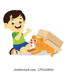boy playing with cat in cardboard
