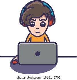 boy playing computer with headphones
