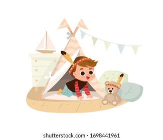 Boy playing at home. Interior decor. Native American Indian costume.