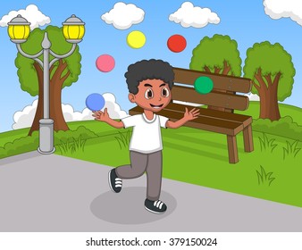 Boy playing juggling and running at the park