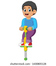  the boy is playing with the jumping stick with the happy face
