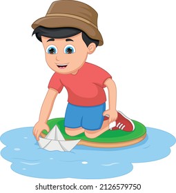 boy playing with paper boat in a water