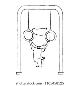 boy playing in park playground rings hanging