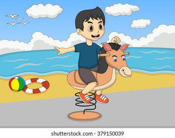 Boy playing rocking horse at the beach