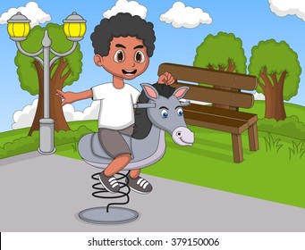 Boy playing rocking horse at the park