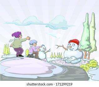 boy playing with snowman