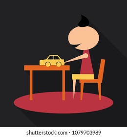 boy playing with toy car on the table. boy sitting on the chair